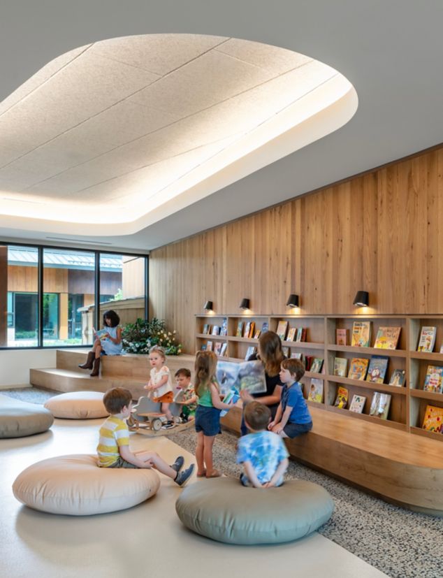 Interface HN840 plank carpet tile with nora by Interface norament satura rubber flooring in children's library/reading area